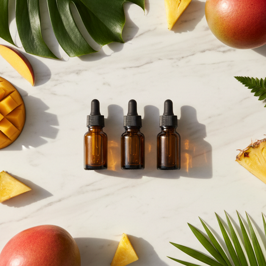 Flat lay of essential oil bottles with tropical fruits